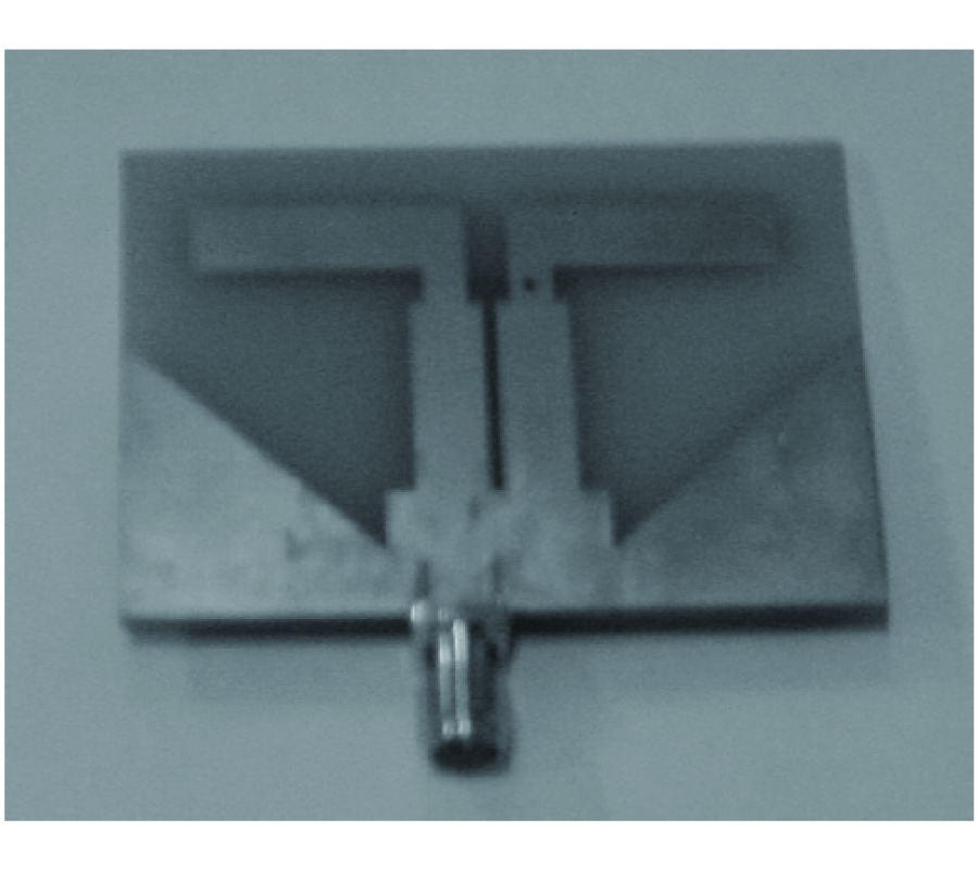 A MINIATURIZED PRINTED DIPOLE ANTENNA WITH V-SHAPED GROUND FOR 2.45 GHZ RFID READERS