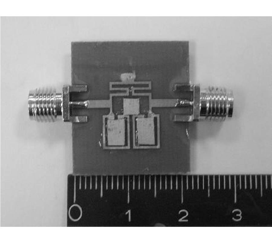 A MINIATURIZED OPEN-LOOP RESONATOR FILTER CONSTRUCTED WITH FLOATING PLATE OVERLAYS
