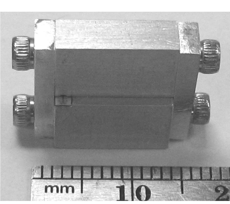 W-BAND MICROSTRIP-TO-WAVEGUIDE TRANSITION USING VIA FENCES