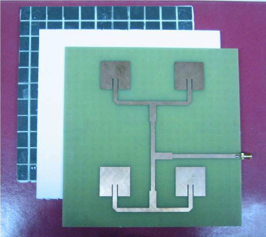 A FREQUENCY SELECTIVE ABSORBING GROUND PLANE FOR LOW-RCS MICROSTRIP ANTENNA ARRAYS