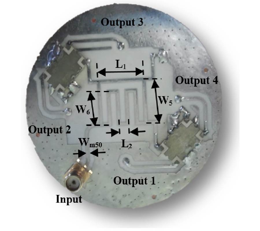 QUADRIFILAR HELIX ANTENNA USING COMPACT LOW-COST PLANAR FEEDING CIRCUIT IN ARRAY CONFIGURATION