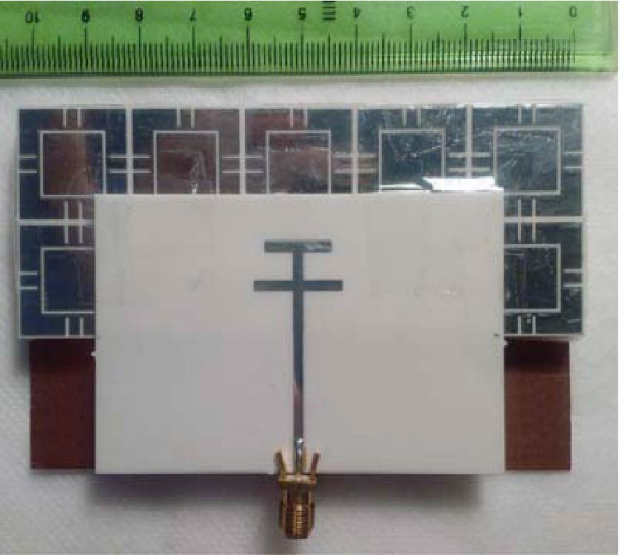 IMPROVED PERFORMANCE OF DOUBLE-T MONOPOLE ANTENNA FOR 2.4/5.6 GHZ DUAL-BAND WLAN OPERATION USING ARTIFICIAL MAGNETIC CONDUCTORS